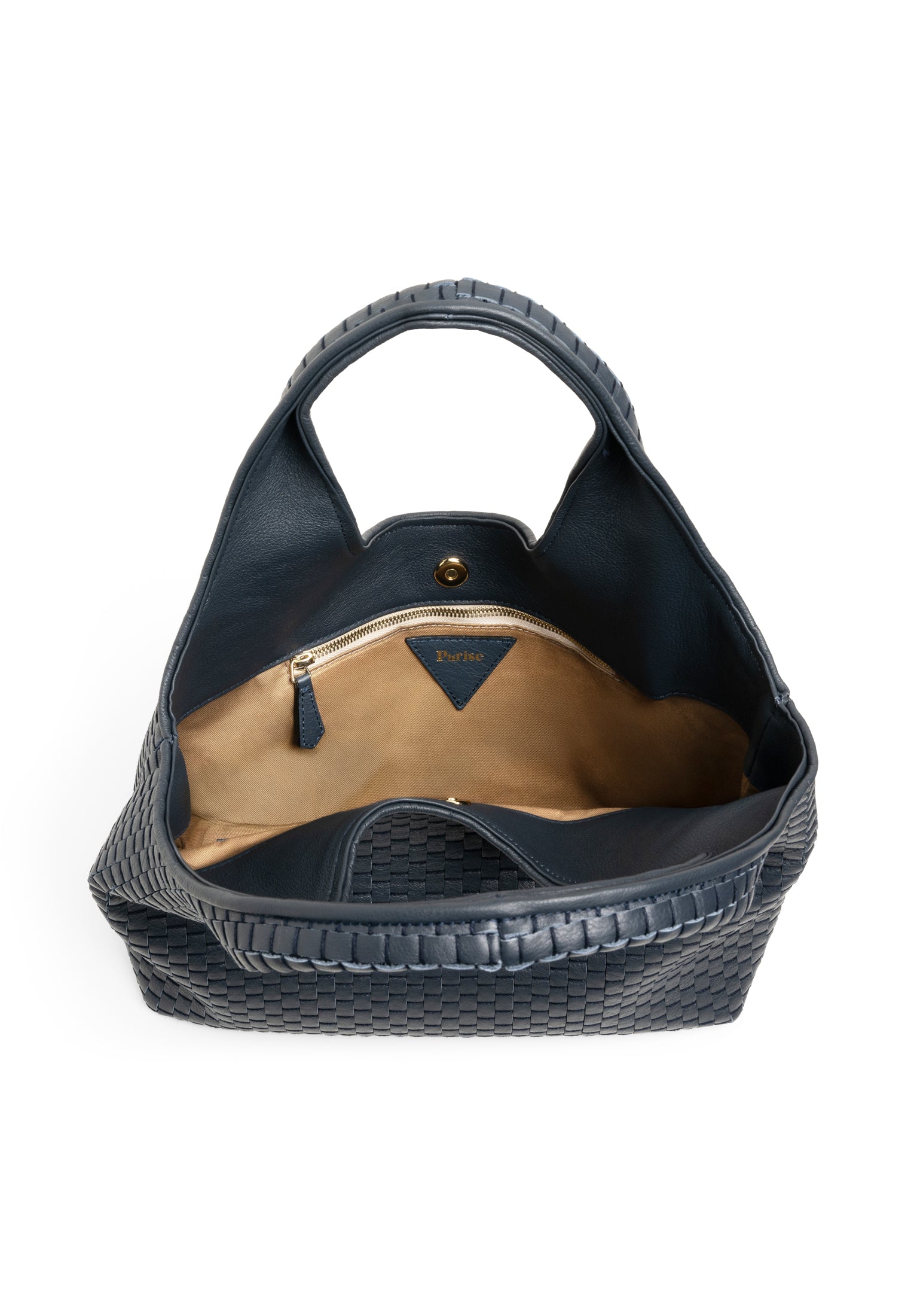 Interior view of the Parise 1312 Handlebag in Navy Blue, showcasing the spacious cotton-lined compartments and zippered pocket