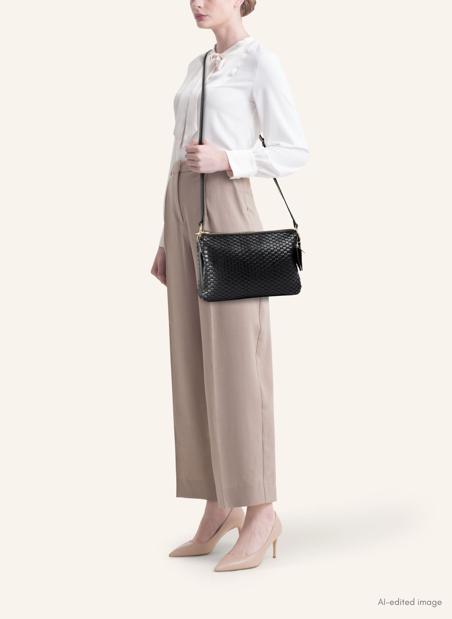 Model wearing the 21 Crossbody Bag, styled as a crossbody for a chic everyday look.