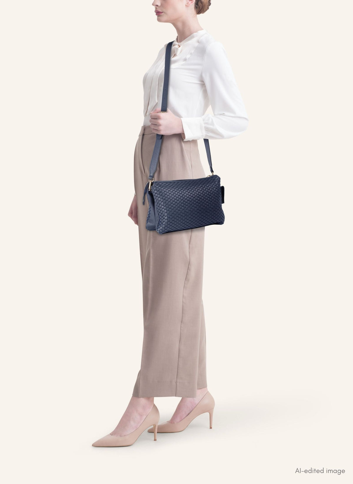 Model wearing the 21 Crossbody Bag, styled as a crossbody for a chic everyday look.