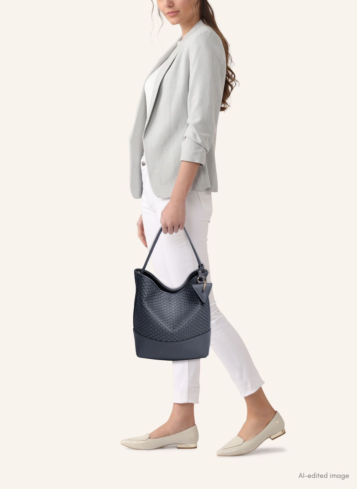 Model wearing the 51 Large Bucket Bag, styled as a sophisticated everyday statement piece.