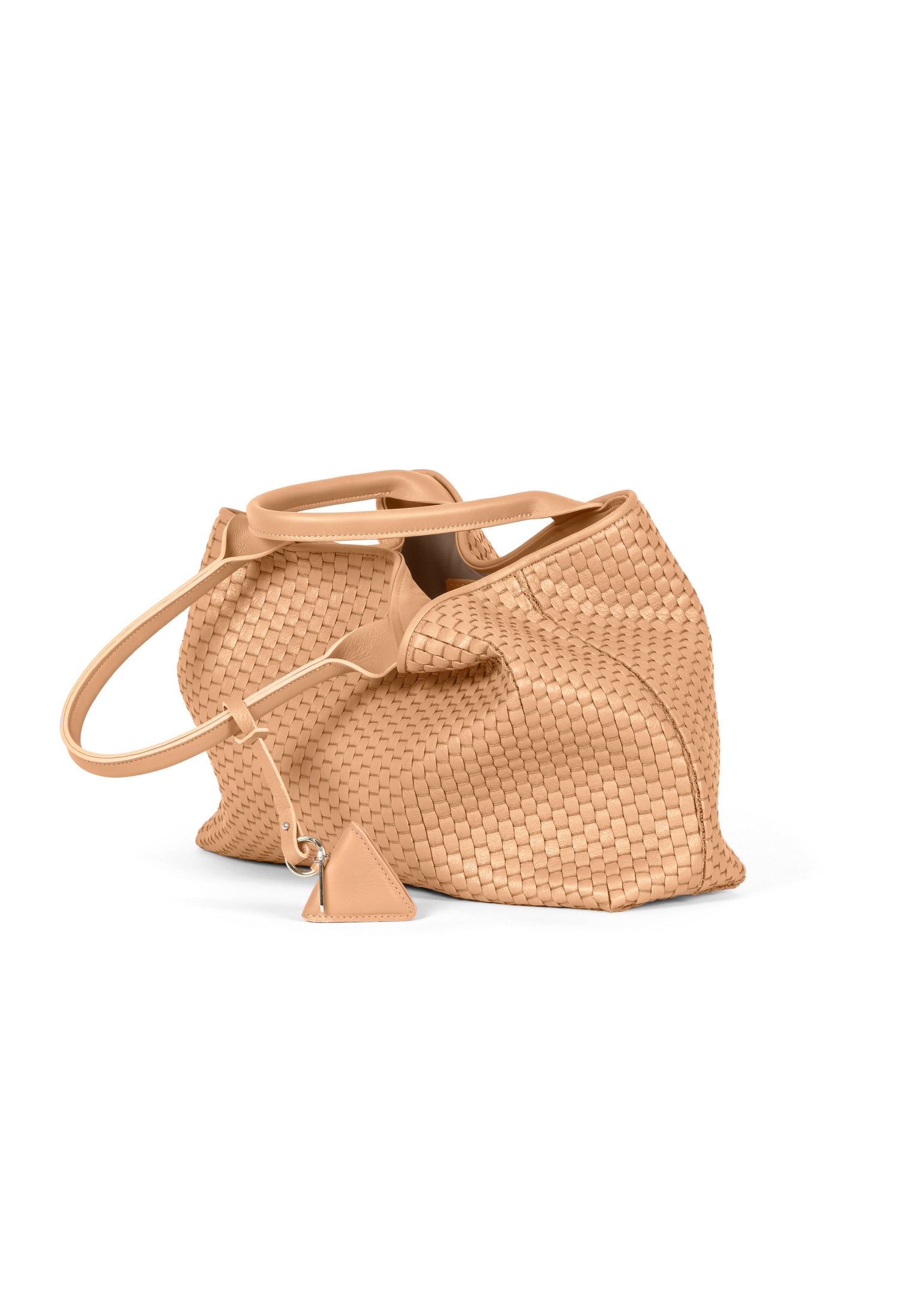Side profile of the 60 Medium Camel tote, highlighting its spacious design and premium handwoven leather.