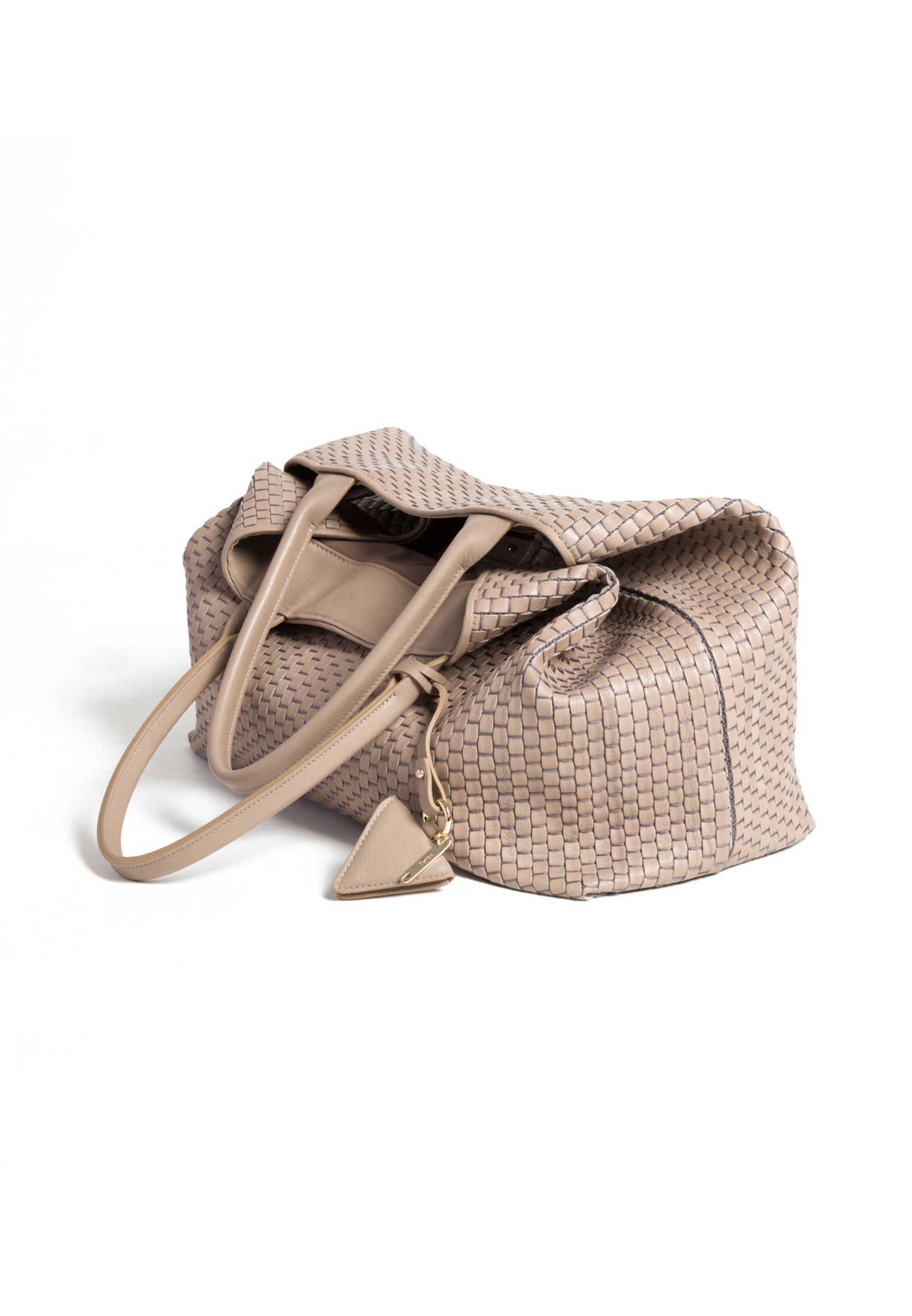 Side profile of the 60 Large Acacia tote, highlighting its spacious design and premium handwoven leather.