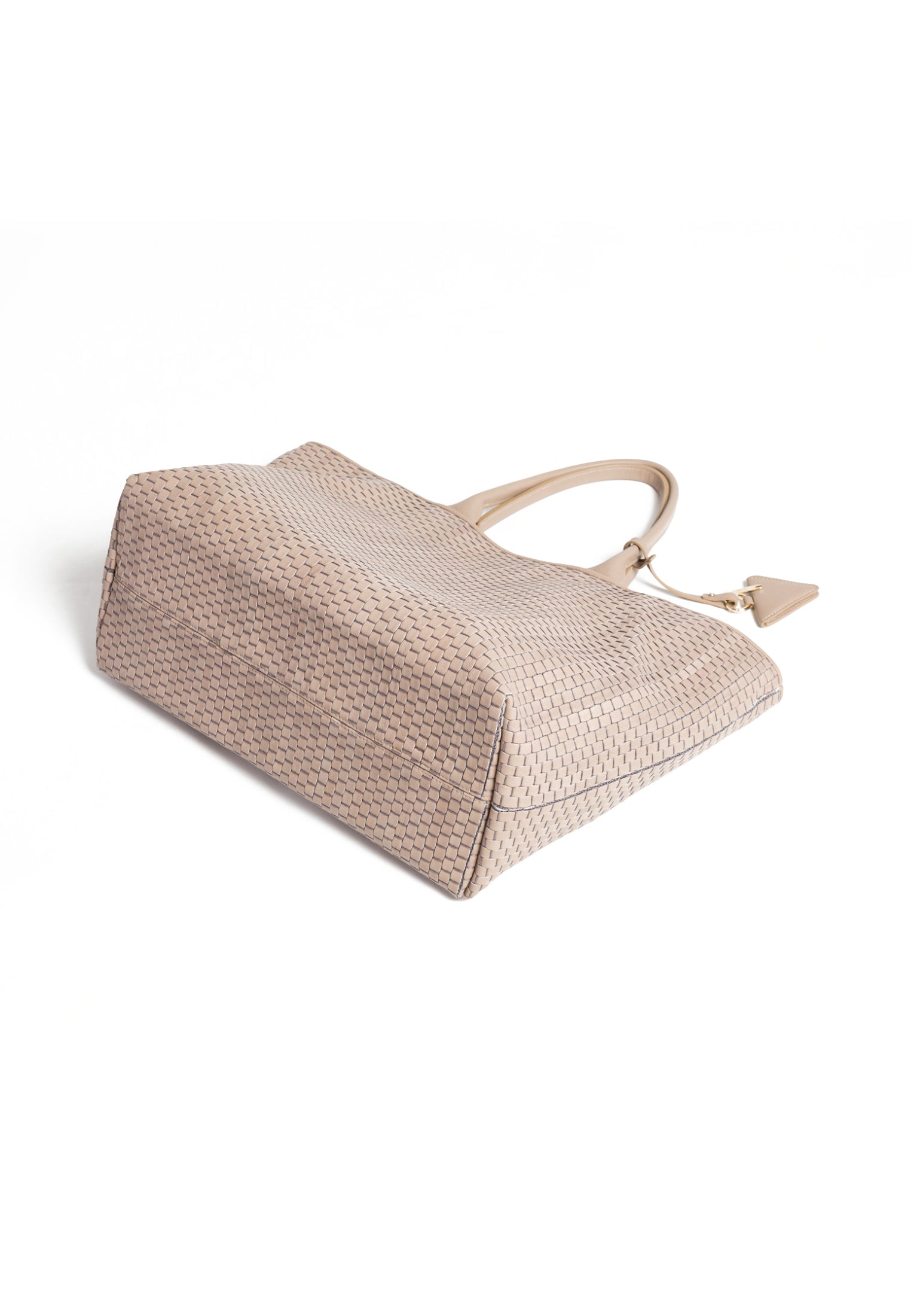 Flatlay of the 60 Large Tote bag with accessories, emphasizing its versatility and timeless elegance.