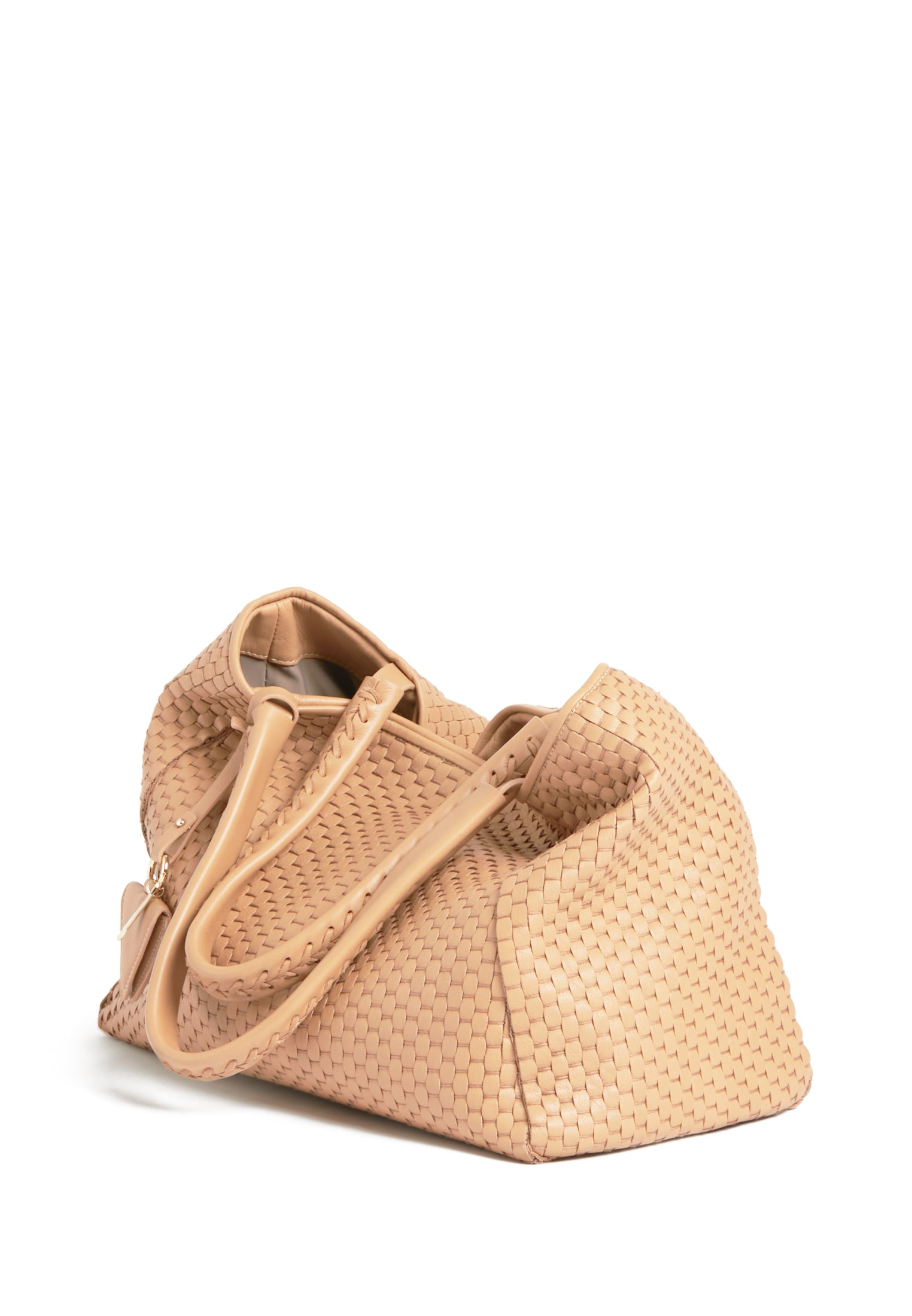 Side profile of the 09 Plain Camel bag, highlighting its structured silhouette and warm beige tone
