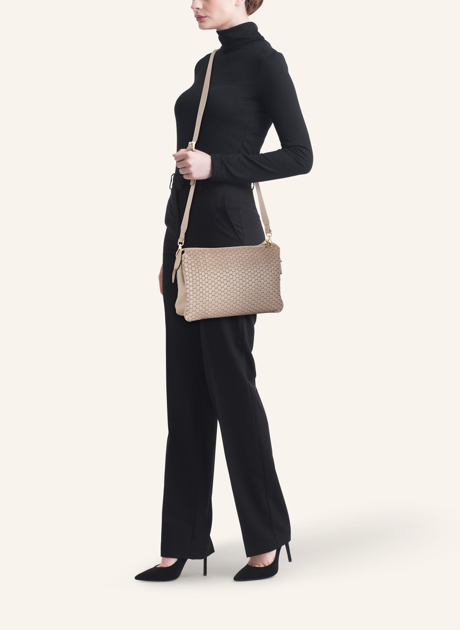 Model wearing the 21 Crossbody Bag in Acacia, styled as a crossbody for a chic everyday look.