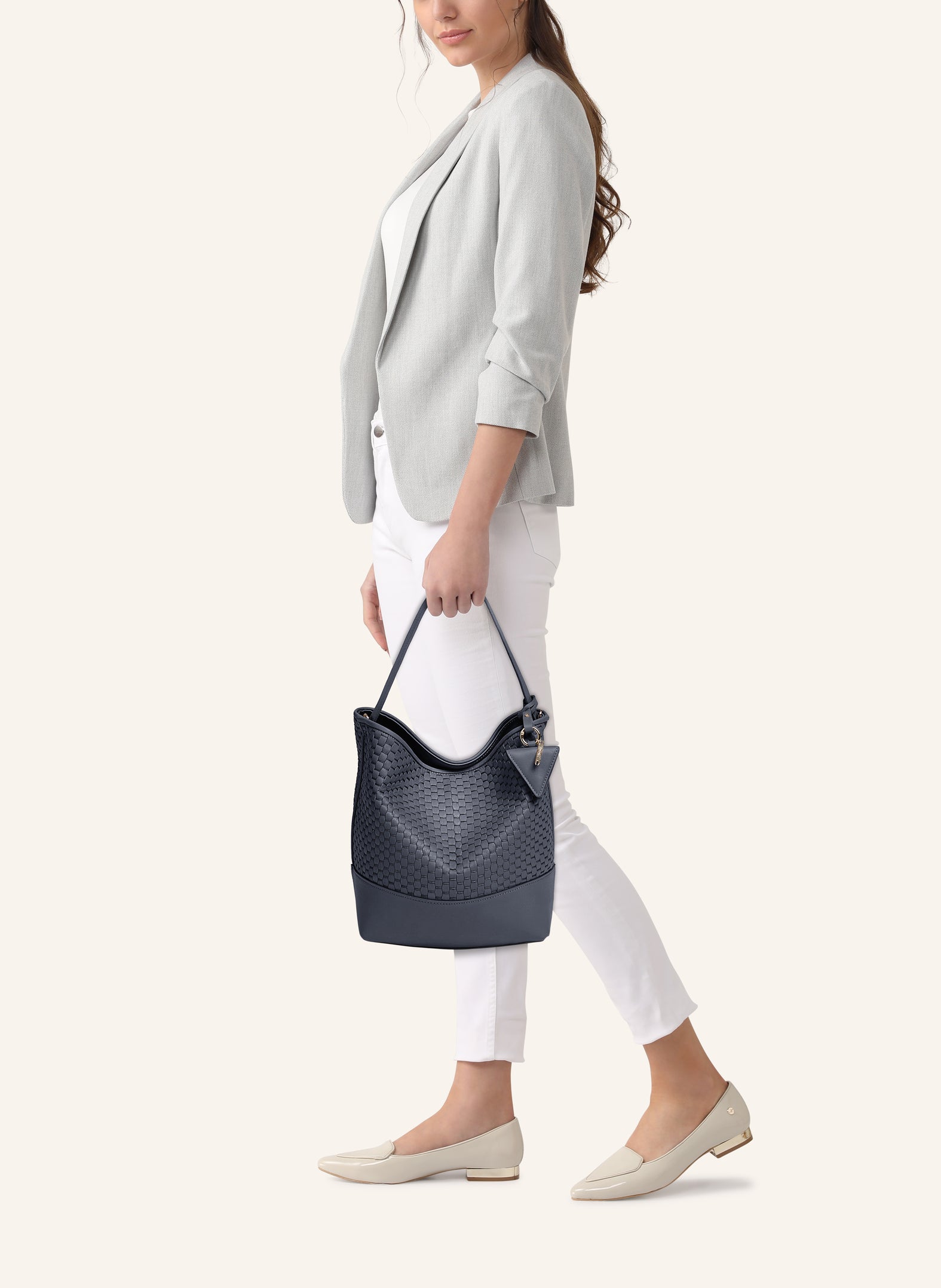 Model wearing the 51 Large Bucket Bag, styled as a sophisticated everyday statement piece.